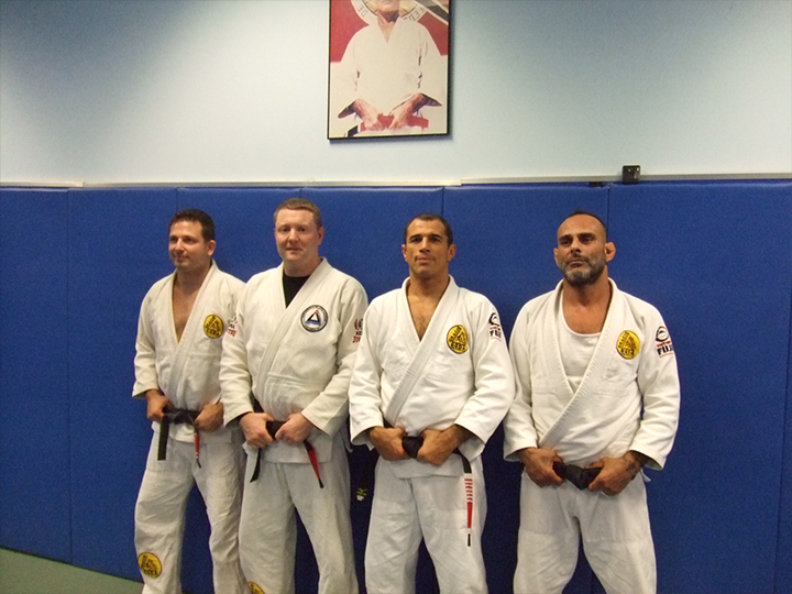 Receiving my Blackbelt in Gracie Jiu-Jitsu from Royler Gracie pictured with my instructors, Lois Vintaloro